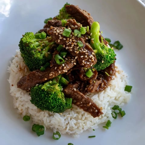 Tender beef and Broccoli stir-fry, a delicious Chinese-American classic, served over fluffy rice.