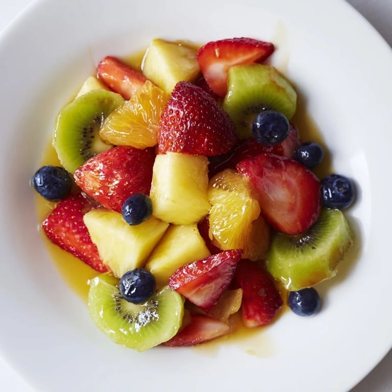 Freshly made fruit salad, bursting with the natural sweetness of summer's best fruits, ready.