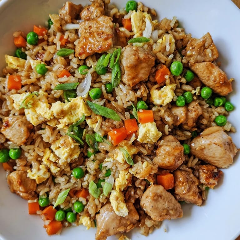 Vibrant image of homemade chicken fried rice, featuring tender chicken and rice, ready to eat.